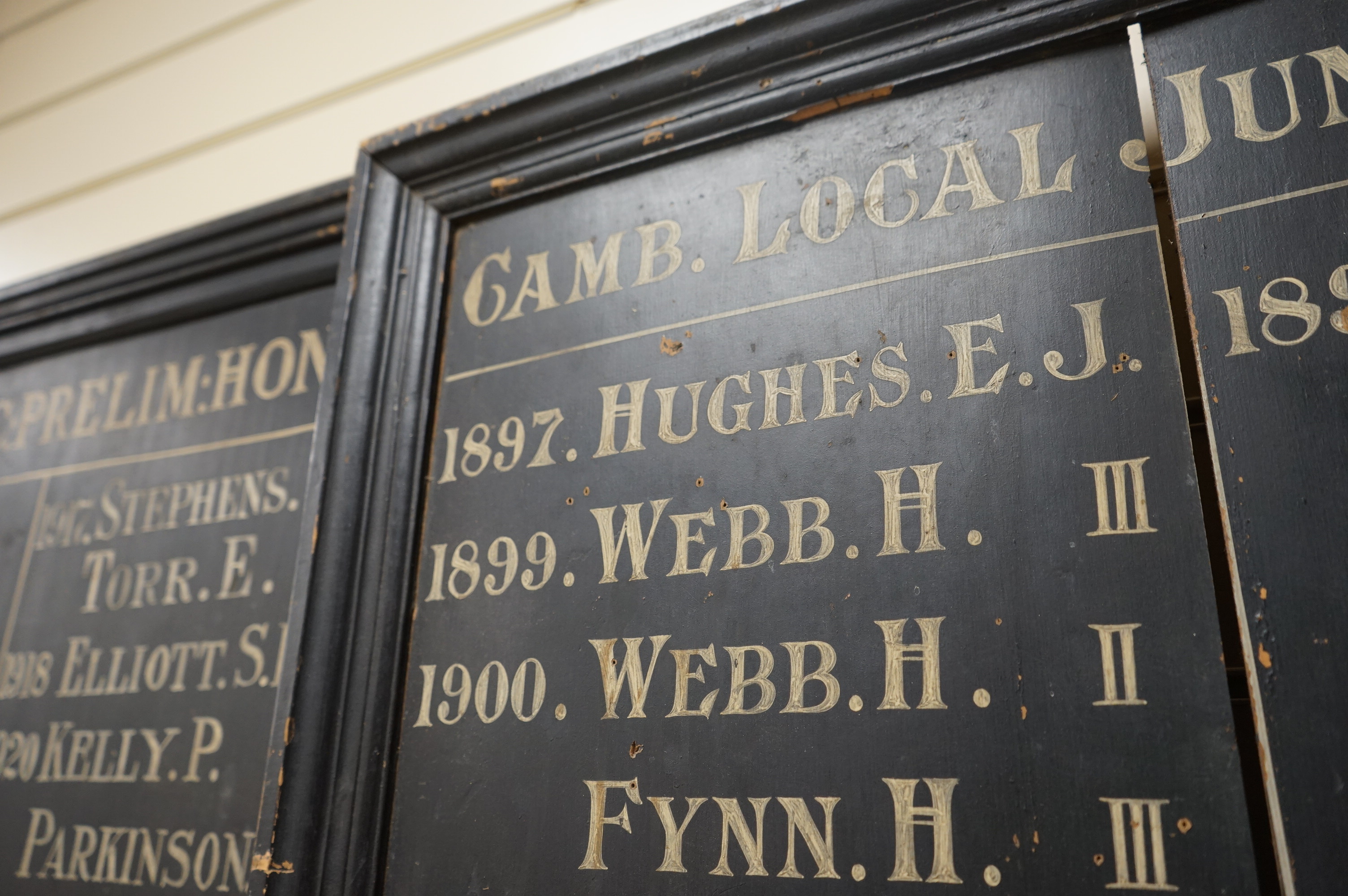 A pair of early to mid 20th century painted ‘Cambridge Local Junior Honours’ boards, 103 x 71cm. Condition - fair to good